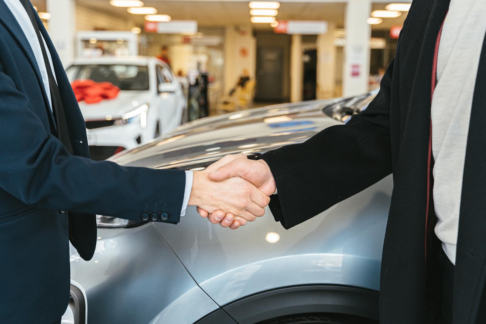 Dealer handshake on the lot